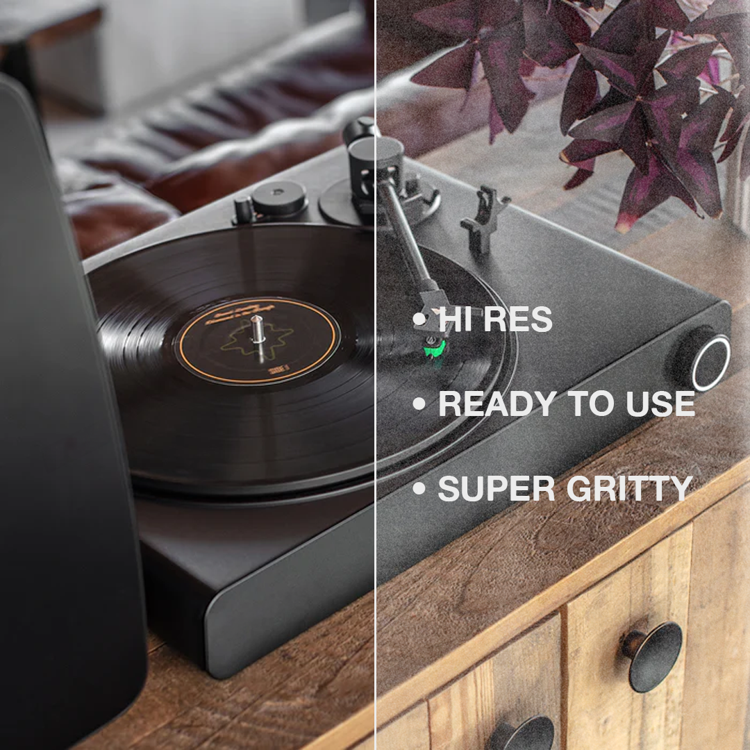 Victrola on a wood table playing music. Left half without texture, right half with texture